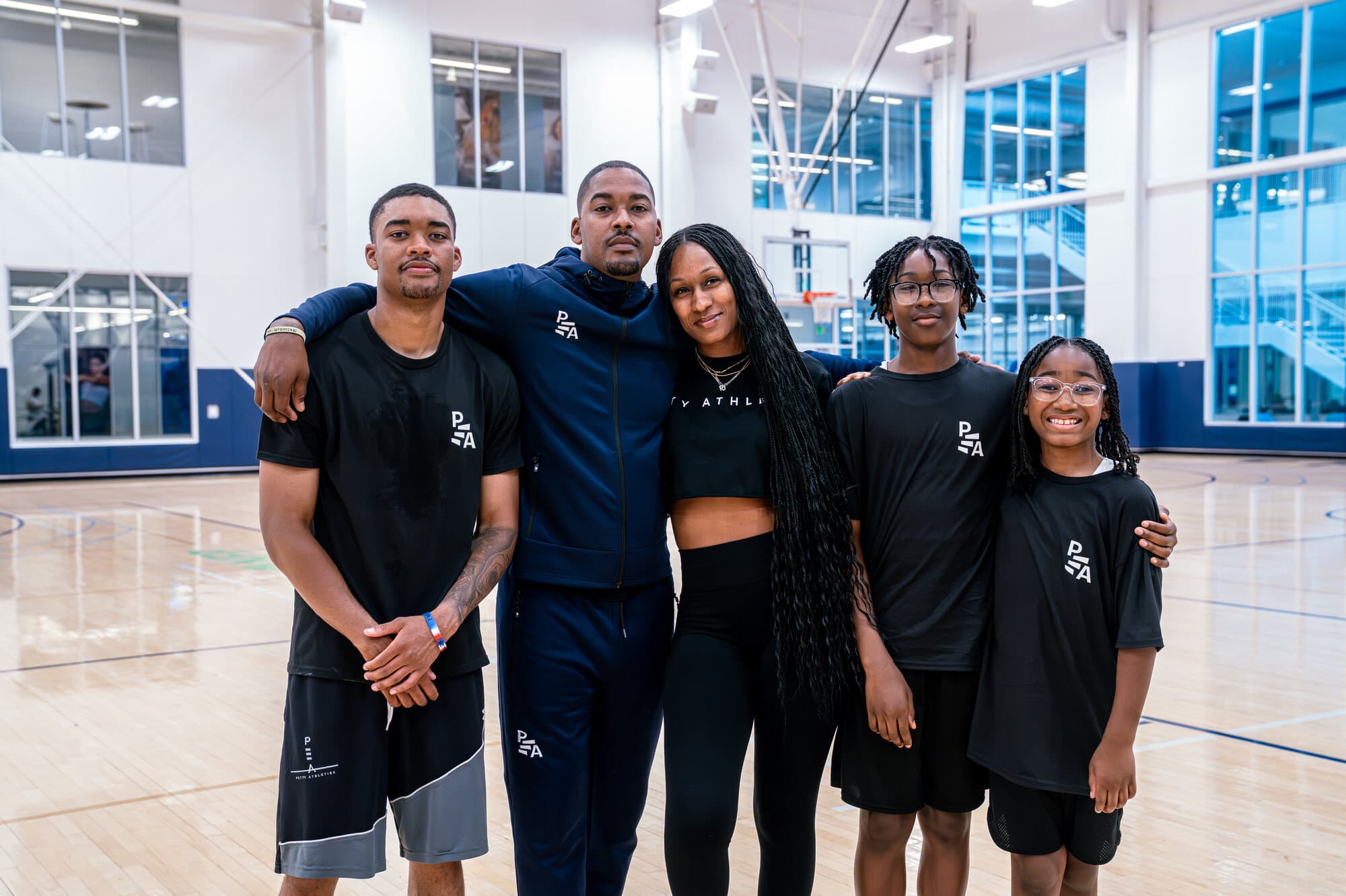 Rashad Petty standing with the Petty Athletics training group after a gym session